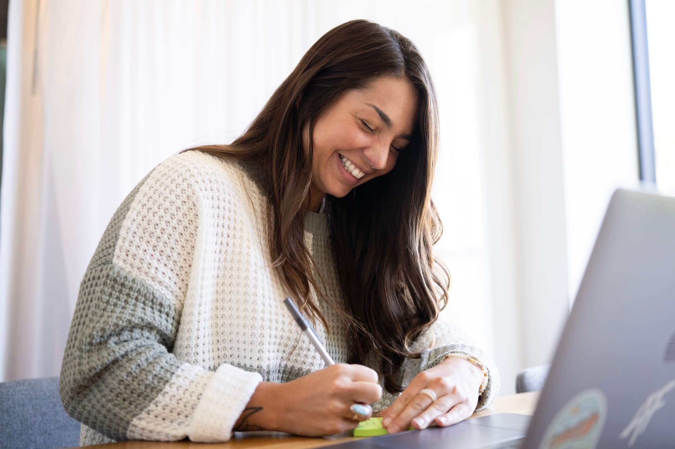 woman writing an intention